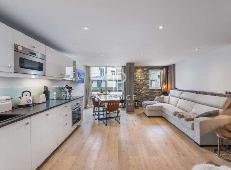 Discover modern living in this stunning property, featuring a sleek kitchen with high-end appliances and ample counter space.