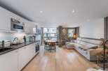 Discover modern living in this stunning property, featuring a sleek kitchen with high-end appliances and ample counter space.