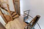 Discover the charm of this property with its unique wooden staircase and inviting entryway.