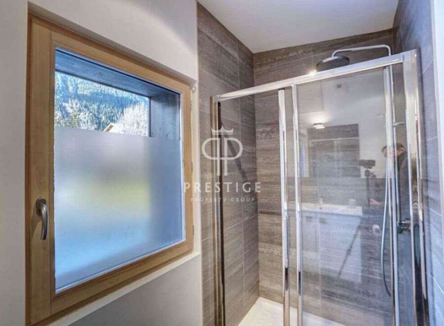 Discover a luxurious bathroom with a modern shower enclosure.