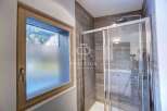 Discover a luxurious bathroom with a modern shower enclosure.