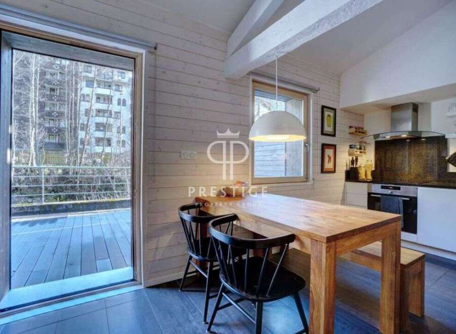 Discover a stunning property with a modern kitchen and dining area.