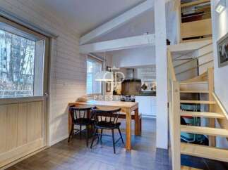 Discover a charming property with a cozy dining area, perfect for intimate gatherings.