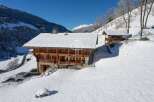 Discover a stunning chalet nestled in a winter wonderland.