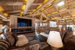 Experience luxury living in this stunning property, showcasing exquisite wooden architecture and a cozy ambiance.