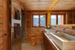 Experience rustic luxury in this stunning bathroom.