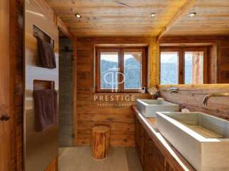 Experience rustic luxury in this stunning bathroom.