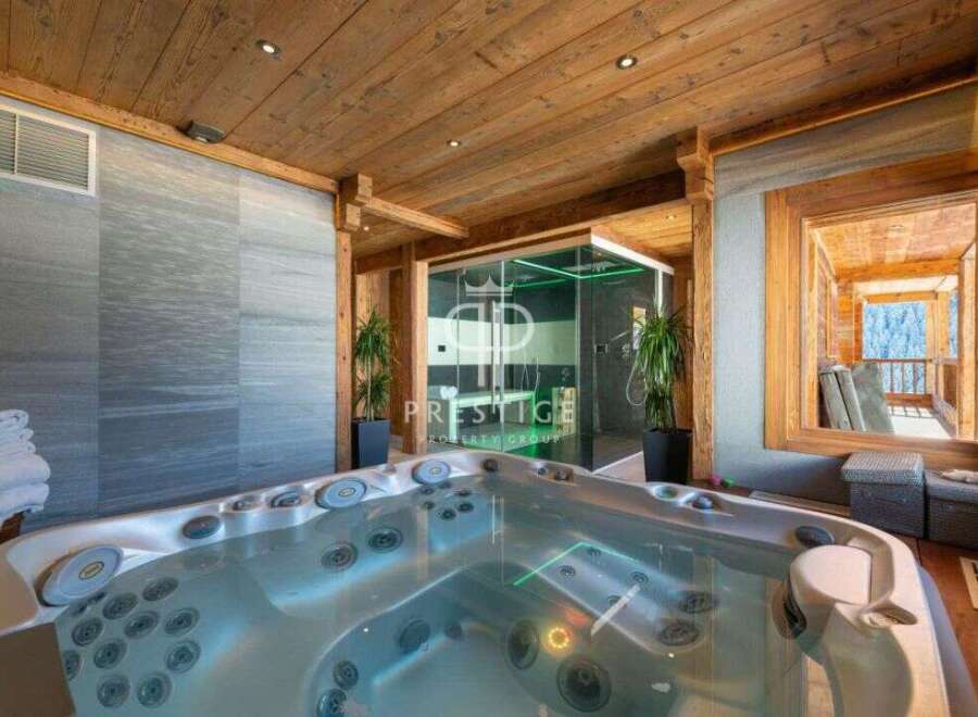 Indulge in luxury with this stunning property featuring a private jacuzzi, perfect for relaxation.
