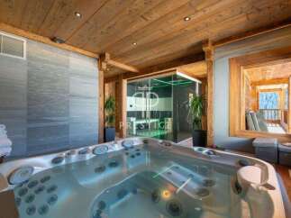 Indulge in luxury with this stunning property featuring a private jacuzzi, perfect for relaxation.