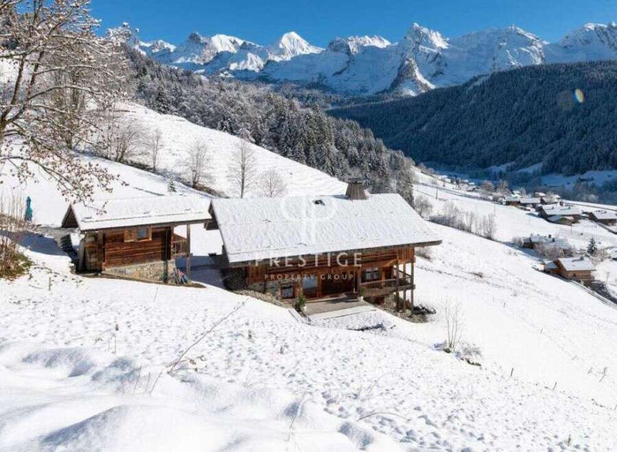 Discover a stunning chalet nestled in a picturesque snowy landscape.