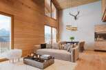 Experience luxury living in this stunning property, featuring exquisite wooden accents and breathtaking mountain views.