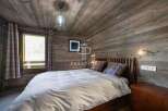 Experience rustic charm in this cozy bedroom.
