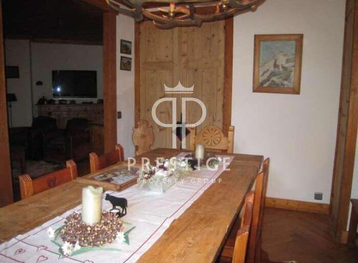 This charming property boasts a rustic dining area, perfect for gatherings.