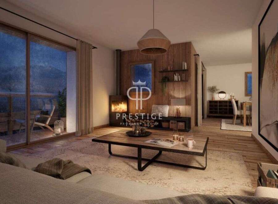 Experience luxury living in this stunning property, featuring a cozy fireplace and a spacious living area.