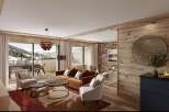 This stunning chalet boasts a spacious open-plan living area with floor-to-ceiling windows offering breathtaking mountain views.