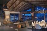 Experience luxury living in this stunning chalet, boasting a cozy ambiance with wooden beams and a breathtaking mountain view.