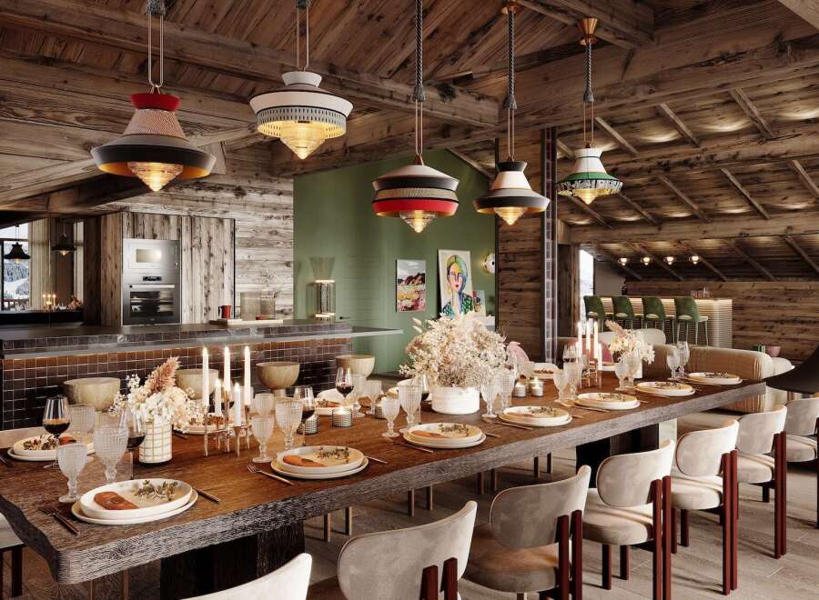 This stunning chalet boasts a spacious dining area with a long wooden table perfect for gatherings, complemented by unique pendant lights and a cozy fireplace.