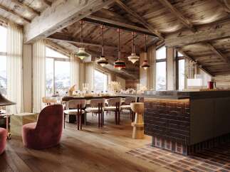 This stunning chalet boasts a spacious open-plan living area with floor-to-ceiling windows offering breathtaking mountain views, a cozy fireplace, and a modern kitchen.
