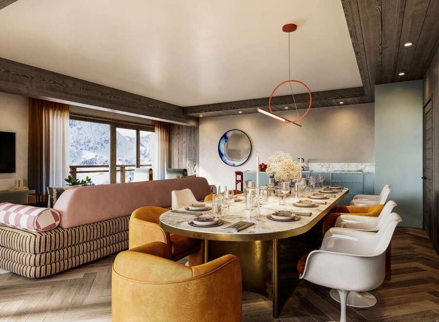 This luxurious apartment boasts a spacious open-plan living area with stunning mountain views, a chic dining setting perfect for entertaining, and a modern kitchen.