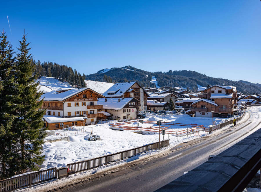 This stunning property boasts breathtaking views of snow-capped mountains and a charming village setting.