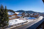 This stunning property boasts breathtaking views of snow-capped mountains and a charming village setting.