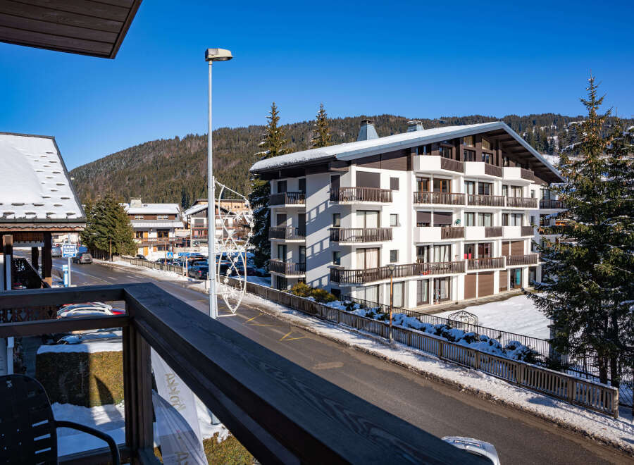 This stunning property boasts breathtaking views of snow-capped mountains and a charming village street.