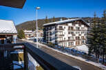 This stunning property boasts breathtaking views of snow-capped mountains and a charming village street.