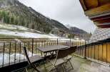Enjoy breathtaking mountain views from this charming balcony.