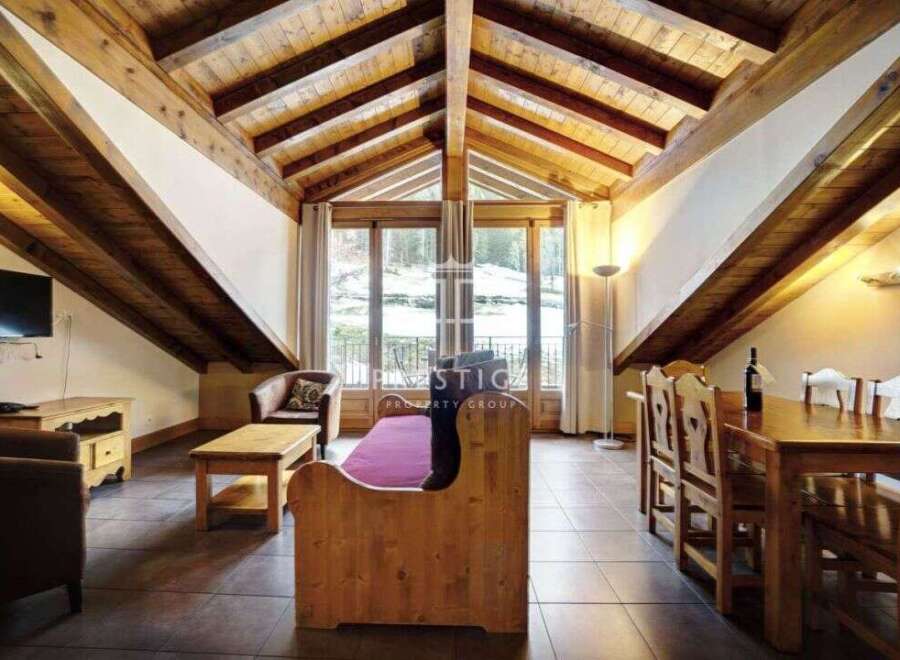 Discover the charm of this stunning property, featuring a unique architectural design with exposed wooden beams.