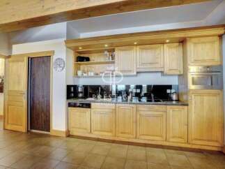 Discover a stunning kitchen with custom wooden cabinetry, perfect for culinary enthusiasts.