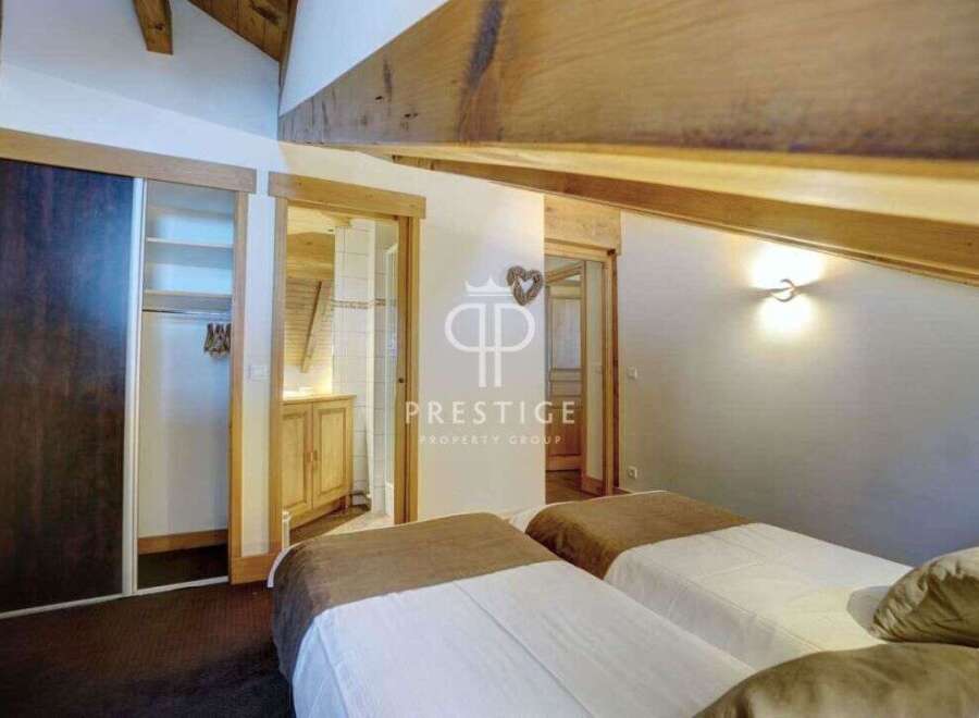 Discover the charm of this property, featuring a cozy bedroom with two beds.