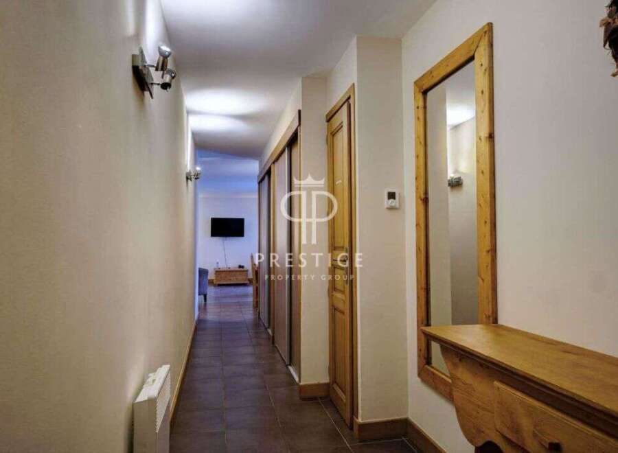 Discover a beautifully designed hallway with a warm and inviting atmosphere.