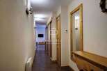 Discover a beautifully designed hallway with a warm and inviting atmosphere.