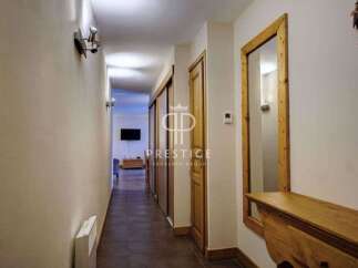 Discover a beautifully designed hallway with a warm and inviting atmosphere.
