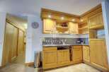 Discover a charming kitchen with wooden cabinetry, offering a warm and inviting atmosphere.