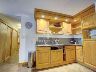 Discover a charming kitchen with wooden cabinetry, offering a warm and inviting atmosphere.