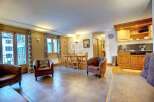Discover the charm of this inviting property, featuring a cozy living area with comfortable seating.