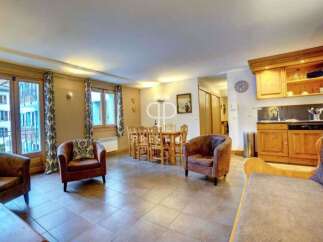 Discover the charm of this inviting property, featuring a cozy living area with comfortable seating.