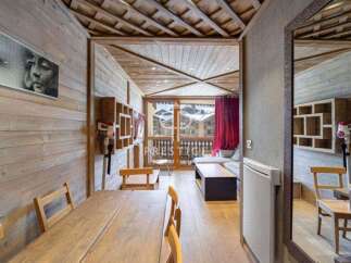 Discover a cozy retreat with this charming property, featuring warm wooden accents and a stylish interior.