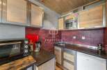Discover a stylish kitchen with modern appliances and sleek design.