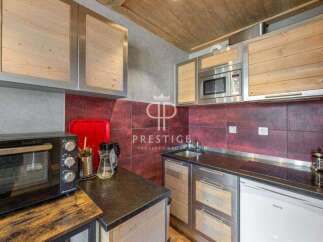 Discover a stylish kitchen with modern appliances and sleek design.