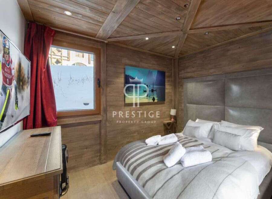 Experience luxury in this stunning chalet bedroom.