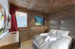 Experience luxury in this stunning chalet bedroom.