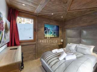 Experience luxury in this stunning chalet bedroom.
