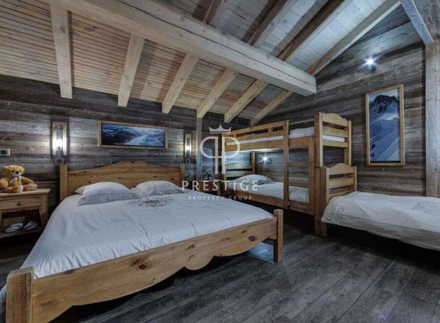 Experience rustic charm in this stunning bedroom featuring wooden accents and a cozy atmosphere.