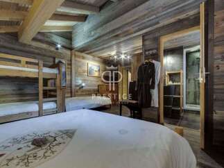 Experience rustic luxury in this stunning chalet bedroom.