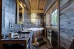 Experience rustic luxury in this stunning bathroom.