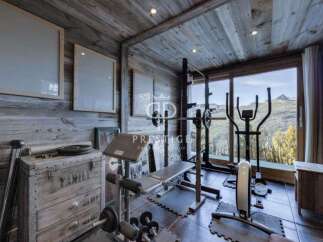 This stunning property boasts a private home gym, perfect for maintaining your fitness routine.