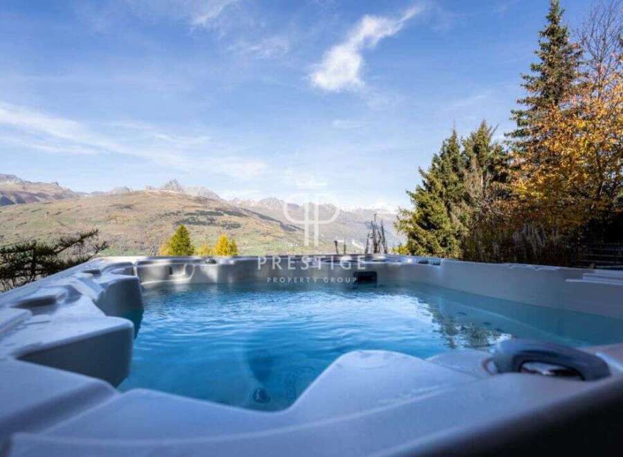 Indulge in luxury with this stunning property featuring a private hot tub.