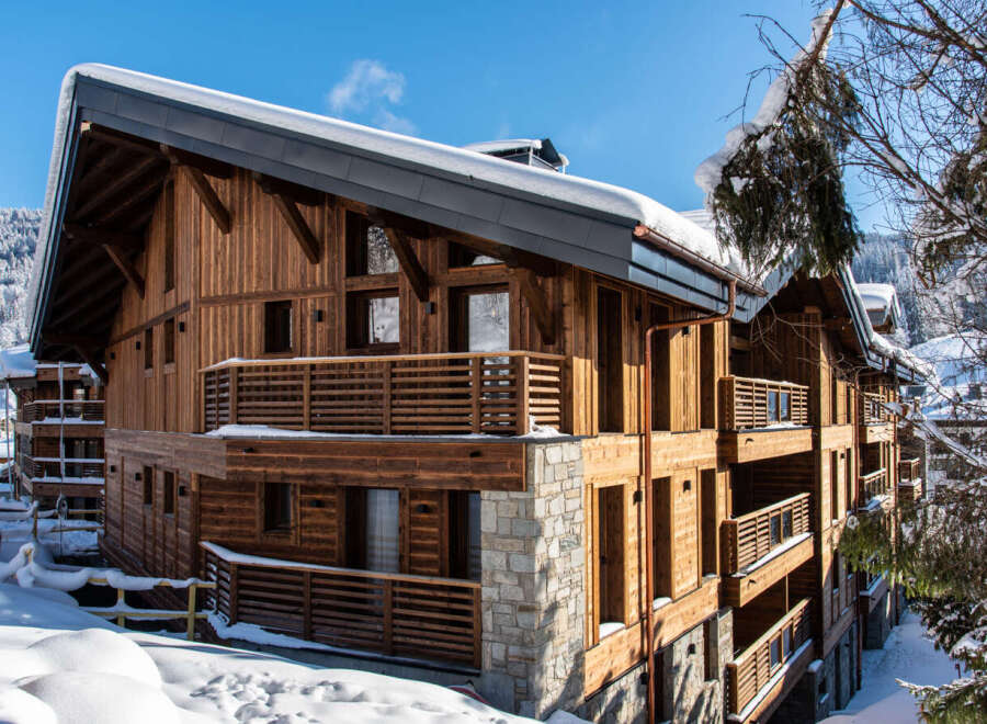 This stunning chalet boasts a unique architectural design, combining rustic wood with modern elements for a luxurious feel.